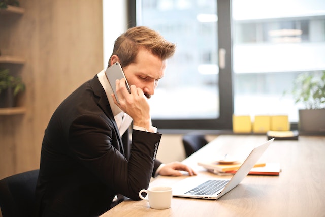 man on the phone with insurance company after car crash