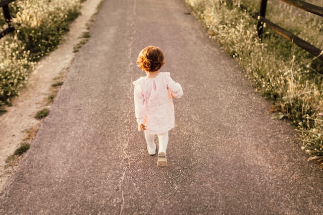 child walking outside