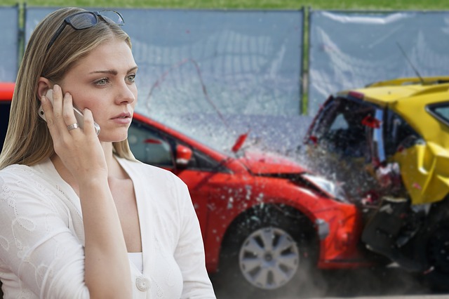 woman making call in front of car crash