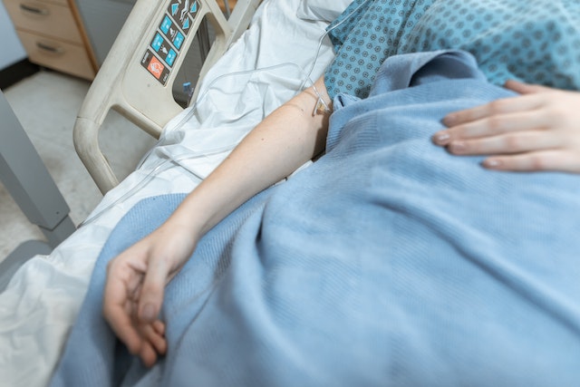 person laying in hospital bed