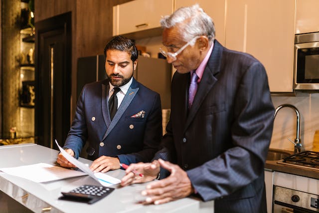 older man talking with younger man