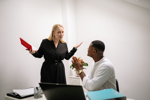 man being yelled at by boss
