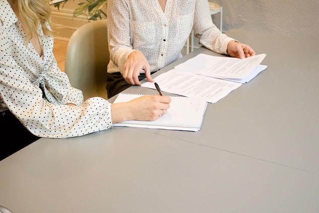 two people reviewing documents