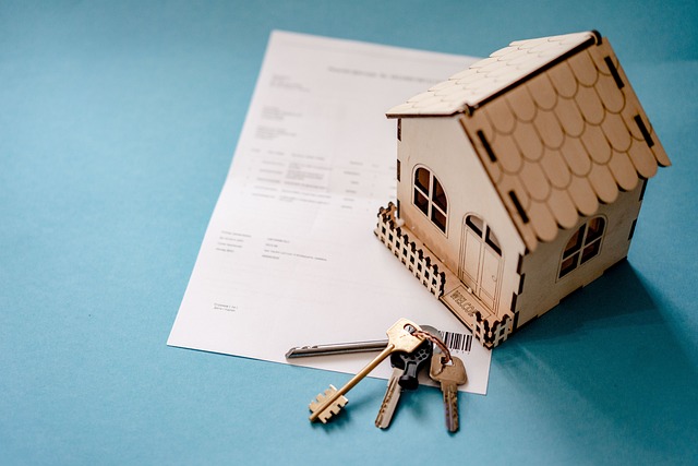 paper, mini house, and keys